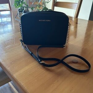 Michael Kors Elegant Black Crossbody Bag with Gold Accents